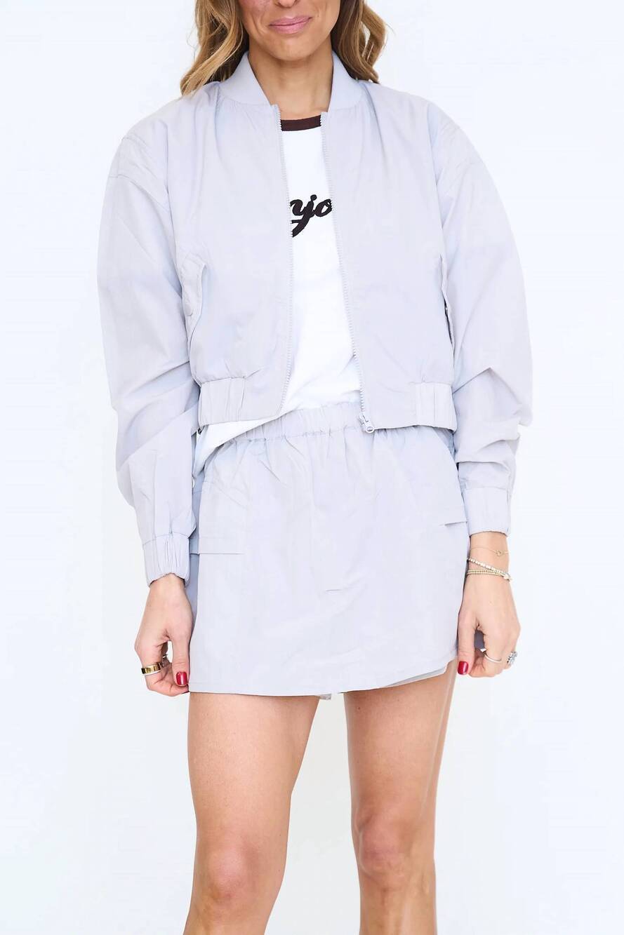 NEW LALAMIA stretch woven bomber jacket and skort set in silver